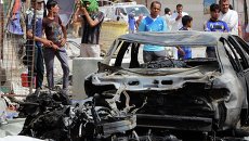 Ситуация в Ираке. 11 июня 2014 года начиненный взрывчаткой автомобиль взорвался возле города Басра Ситуация в Ираке. 11 июня 2014 года начиненный взрывчаткой автомобиль взорвался возле города Басра