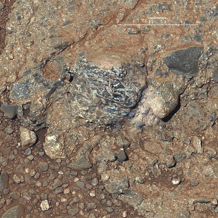 Снимок с марсохода Curiosity марсианской породы Харрисона с фрагментами кристаллов Снимок с марсохода Curiosity марсианской породы Харрисона с фрагментами кристаллов