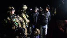 Военнопленные ДНР и ЛНР во время процедуры обмена между ополченцами ДНР, ЛНР и украинскими силовиками. Архивное фото Военнопленные ДНР и ЛНР во время процедуры обмена между ополченцами ДНР, ЛНР и украинскими силовиками. Архивное фото