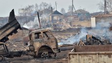 Последствия природных пожаров в селе Знаменка Республики Хакасия. Архивное фото Последствия природных пожаров в селе Знаменка Республики Хакасия. Архивное фото