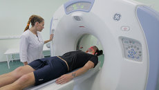 Работа на компьютерном томографе GE Healthcare. Архивное фото Работа на компьютерном томографе GE Healthcare. Архивное фото