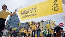 Баннер с логотипом организации Amnesty International Баннер с логотипом организации Amnesty International