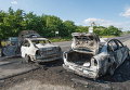 Сожженные полицейские машины в Мукачево, Украина. 11 июля 2015 Сожженные полицейские машины в Мукачево, Украина. 11 июля 2015