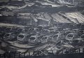 Обгоревшие автомобили на месте взрыва в Тяньцзинь Обгоревшие автомобили на месте взрыва в Тяньцзинь