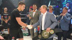 Президент России Владимир Путин и российский самбист, чемпион России, Европы и мира по боевому самбо Вадим Немков Президент России Владимир Путин и российский самбист, чемпион России, Европы и мира по боевому самбо Вадим Немков