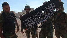 Освобождение Атшана: ликование сирийских солдат и сожжение флага боевиков Освобождение Атшана: ликование сирийских солдат и сожжение флага боевиков