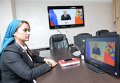 Сотрудница МЧС России по Чеченской Республике смотрит телевизионную трансляцию послания президента РФ Владимира Путина к Федеральному Собранию Сотрудница МЧС России по Чеченской Республике смотрит телевизионную трансляцию послания президента РФ Владимира Путина к Федеральному Собранию