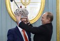 Президент России Владимир Путин и художественный руководитель Московского государственного театра эстрады Геннадий Хазанов во время встречи в Кремле Президент России Владимир Путин и художественный руководитель Московского государственного театра эстрады Геннадий Хазанов во время встречи в Кремле