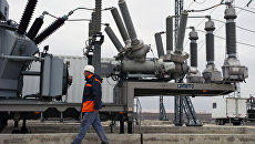 Силовое оборудование трансформаторов на площадке размещения мобильных газотурбинных электростанций (МГТЭС) Западно-Крымская вблизи г. Саки в Крыму. Архивное фото Силовое оборудование трансформаторов на площадке размещения мобильных газотурбинных электростанций (МГТЭС) Западно-Крымская вблизи г. Саки в Крыму. Архивное фото