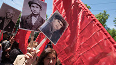 Участники акции Бессмертный полк. Архивное фото Участники акции Бессмертный полк. Архивное фото