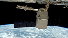 Отстыковка космического грузовика Dragon от МКС. Архивное фото Отстыковка космического грузовика Dragon от МКС. Архивное фото