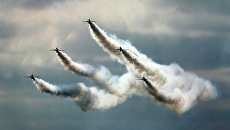 Выступление пилотажной группы Red Arrows на международном авиакосмическом салоне Фарнборо Выступление пилотажной группы Red Arrows на международном авиакосмическом салоне Фарнборо