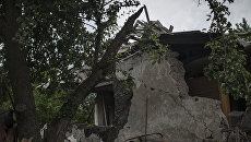 Один из домов в Горловке, разрушенный в результате обстрела. Архивное фото Один из домов в Горловке, разрушенный в результате обстрела. Архивное фото