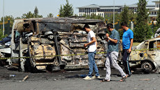 Burnt cars at the presidential palace in Ankara during the coup attempt.  Archival photo