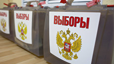 Мобильные урны для голосования. Архивное фото Мобильные урны для голосования. Архивное фото