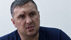 Подозреваемый в подготовке терактов в Крыму Евгений Панов во время допроса. Архивное фото Подозреваемый в подготовке терактов в Крыму Евгений Панов во время допроса. Архивное фото
