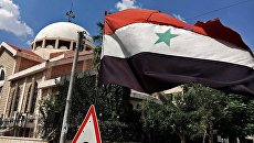 Государственный флаг Сирийской Арабской Республики. Архивное фото Государственный флаг Сирийской Арабской Республики. Архивное фото