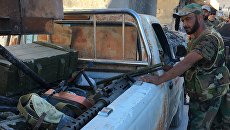 Бойцы бригады ополчения Аль-Кудс в освобожденном от террористов лагере палестинских беженцев Хандарат на северо-востоке Алеппо Бойцы бригады ополчения Аль-Кудс в освобожденном от террористов лагере палестинских беженцев Хандарат на северо-востоке Алеппо