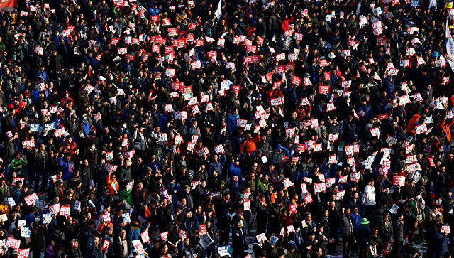 В Сеуле сотни тысяч человек вышли на акцию за отставку президента
