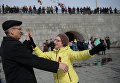 Участники танцевального флешмоба Севастопольский вальс, посвященного третьей годовщине воссоединения Крыма с Россией Участники танцевального флешмоба Севастопольский вальс, посвященного третьей годовщине воссоединения Крыма с Россией