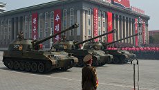 122-мм самоходные пушки М-1991 на бронированном шасси Чучхе-по Корейской народной армии во время парада в Пхеньяне 122-мм самоходные пушки М-1991 на бронированном шасси Чучхе-по Корейской народной армии во время парада в Пхеньяне