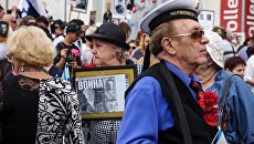 Участники шествия ветеранов ВОВ и акции Бессмертный полк. Архивное фото Участники шествия ветеранов ВОВ и акции Бессмертный полк. Архивное фото