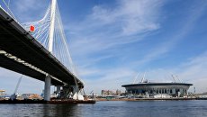 Стадион Санкт-Петербург Арена на Крестовском острове и мост через Петровский фарватер (участок Западного скоростного диаметра) в Санкт-Петербурге. Архивное фото Стадион Санкт-Петербург Арена на Крестовском острове и мост через Петровский фарватер (участок Западного скоростного диаметра) в Санкт-Петербурге. Архивное фото