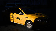 Такси UBER. Архивное фото Такси UBER. Архивное фото