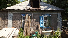 Дом в поселке Михайловке в ЛНР. Архивное фото Дом в поселке Михайловке в ЛНР. Архивное фото