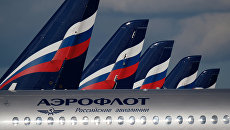 Sukhoi Superjet 100 на стоянке самолетов в аэропорту Шереметьево в Москве Sukhoi Superjet 100 на стоянке самолетов в аэропорту Шереметьево в Москве