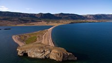 Мыс Уюга в заливе Малое море на озере Байкал в Ольхонском районе Иркутской области Мыс Уюга в заливе Малое море на озере Байкал в Ольхонском районе Иркутской области