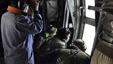Служащие ВМС Аргентины во время поиска пропавшей подлодки Сан-Хуан над Атлантическим океаном. Архивное фото Служащие ВМС Аргентины во время поиска пропавшей подлодки Сан-Хуан над Атлантическим океаном. Архивное фото