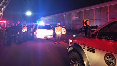На месте столкновения пассажирского поезда компании Amtrak с грузовым железнодорожным составом в штате Южная Каролина, США. 4 февраля 2018 На месте столкновения пассажирского поезда компании Amtrak с грузовым железнодорожным составом в штате Южная Каролина, США. 4 февраля 2018