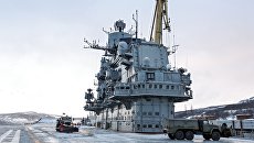 Тяжелый авианесущий крейсер Северного флота Адмирал Кузнецов в Мурманске. Архивное фото Тяжелый авианесущий крейсер Северного флота Адмирал Кузнецов в Мурманске. Архивное фото