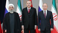Президент Ирана Хасан Рухани, президент Турции Реджеп Тайип Эрдоган и президент РФ Владимир Путин перед началом встречи в Анкаре. 4 апреля 2018 Президент Ирана Хасан Рухани, президент Турции Реджеп Тайип Эрдоган и президент РФ Владимир Путин перед началом встречи в Анкаре. 4 апреля 2018