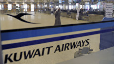 Стойка регистрации авиакомпании Kuwait Airways. Архивное фото Стойка регистрации авиакомпании Kuwait Airways. Архивное фото