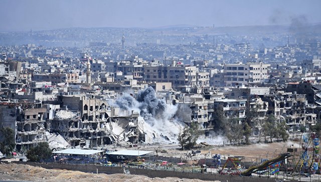 Разрушенные дома в районе лагеря беженцев Ярмук на юге Дамаска