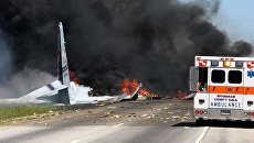 На месте падения американского военно-транспортного самолета C-130 Геркулес в штате Джорджия. 2 мая 2018 На месте падения американского военно-транспортного самолета C-130 Геркулес в штате Джорджия. 2 мая 2018