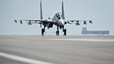 Истребитель Су-30СМ на авиабазе Хмеймим. Архивное фото Истребитель Су-30СМ на авиабазе Хмеймим. Архивное фото
