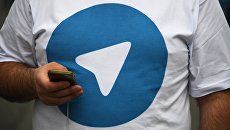 Участник митинга в поддержку мессенджера Telegram. Архивное фото Участник митинга в поддержку мессенджера Telegram. Архивное фото