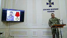 Фотография главного редактора сайта РИА Новости Украина Кирилла Вышинского во время брифинга СБУ. 15 мая 2018 Фотография главного редактора сайта РИА Новости Украина Кирилла Вышинского во время брифинга СБУ. 15 мая 2018