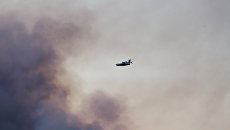 Самолет МЧС РФ тушит пожар над территорией бывшего военного арсенала в поселке Пугачево в Удмуртии. 17 мая 2018 Самолет МЧС РФ тушит пожар над территорией бывшего военного арсенала в поселке Пугачево в Удмуртии. 17 мая 2018