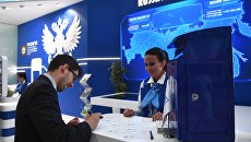 Стенд Почты России на Петербургском международном экономическом форуме. Архивное фото Стенд Почты России на Петербургском международном экономическом форуме. Архивное фото