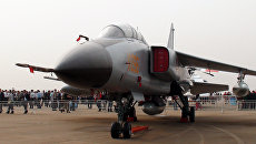 Самолет JH-7A на международном авиасалоне Airshow China. Архивное фото Самолет JH-7A на международном авиасалоне Airshow China. Архивное фото