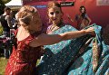Участницы фестиваля индийской культуры, посвященного Дню независимости Индии, в парке Сокольники в Москве Участницы фестиваля индийской культуры, посвященного Дню независимости Индии, в парке Сокольники в Москве
