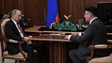 Президент РФ Владимир Путин и руководитель Роскомнадзора Александр Жаров во время встречи Президент РФ Владимир Путин и руководитель Роскомнадзора Александр Жаров во время встречи