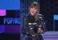 Тэйлор Свифт на церемонии награждения American Music Awards в Лос-Анджелесе Тэйлор Свифт на церемонии награждения American Music Awards в Лос-Анджелесе