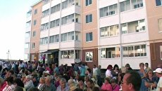 Пострадавшие от наводнения в Крымске заселяются в новые квартиры Пострадавшие от наводнения в Крымске заселяются в новые квартиры