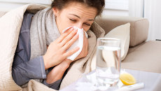 A woman struggling with the flu