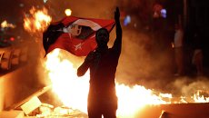 Участник демонстрации в Анкаре, Турция Участник демонстрации в Анкаре, Турция